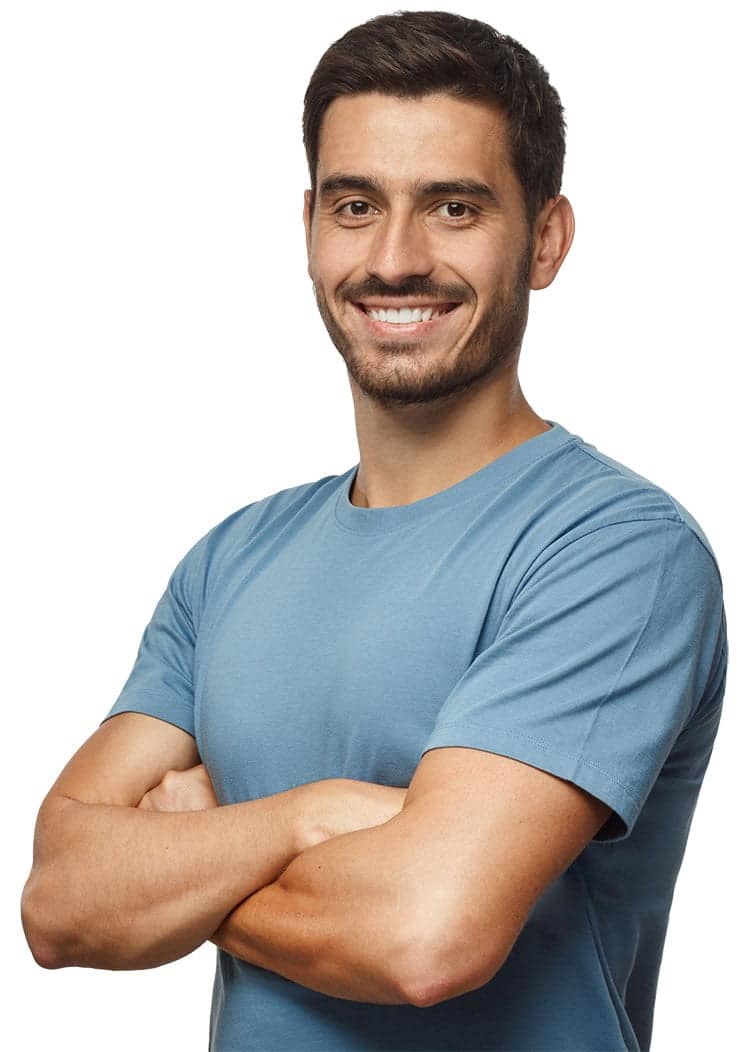 man smiling with crossed arms